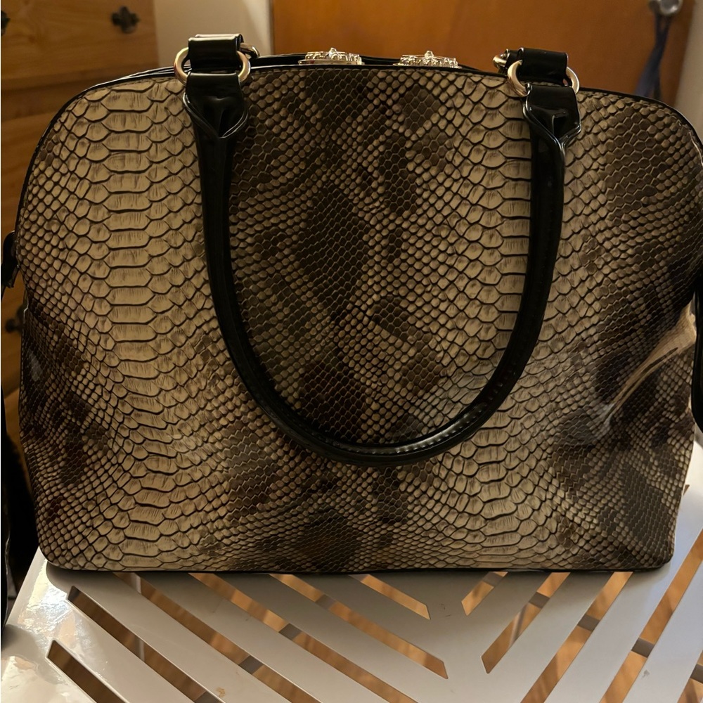 COPY - This is regular snake skin pat and leathers duffel bag with gold trim